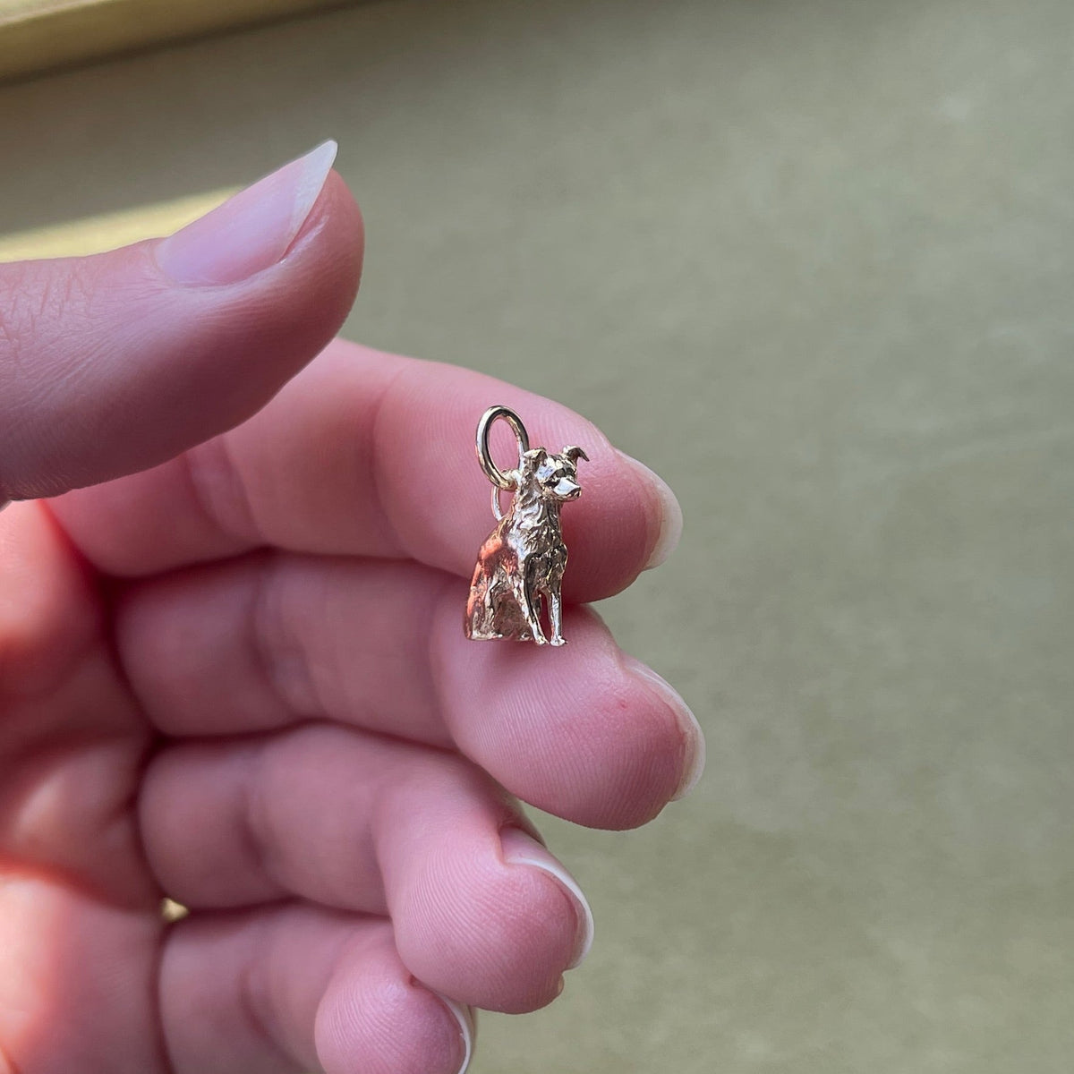 14k solid gold Custom Dog Charm as a custom hand-carved dog portrait