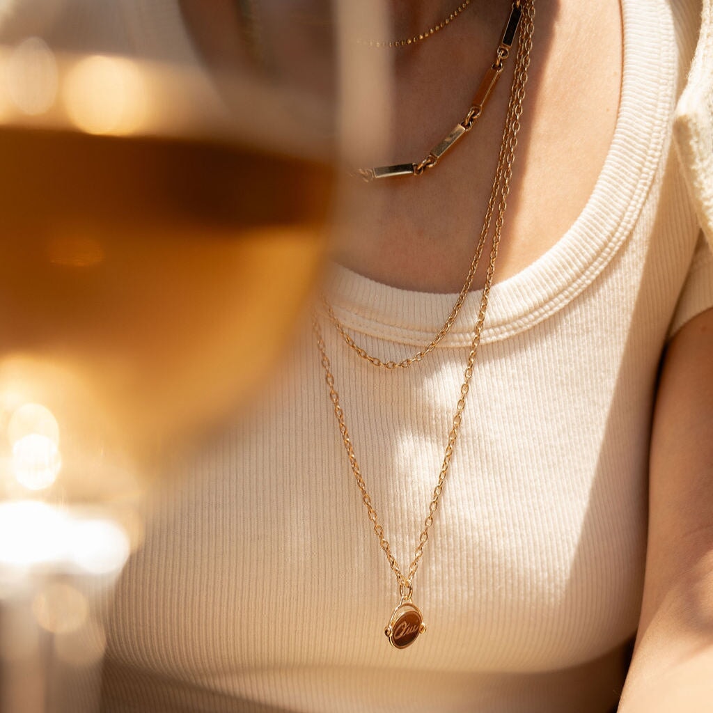 14k solid gold Charme de Décision as a spinning decision charm