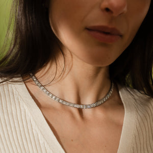 close-up of a vintage platinum diamond tennis necklace with hand engraving details