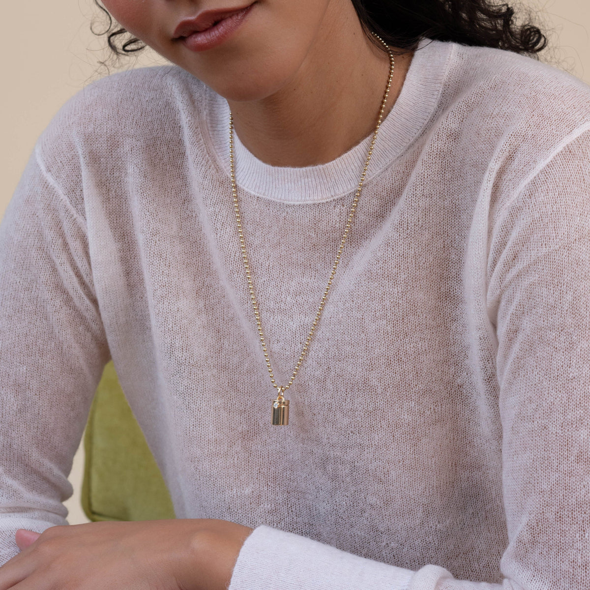 14k solid gold engravable Capsule Charm as an openable capsule locket