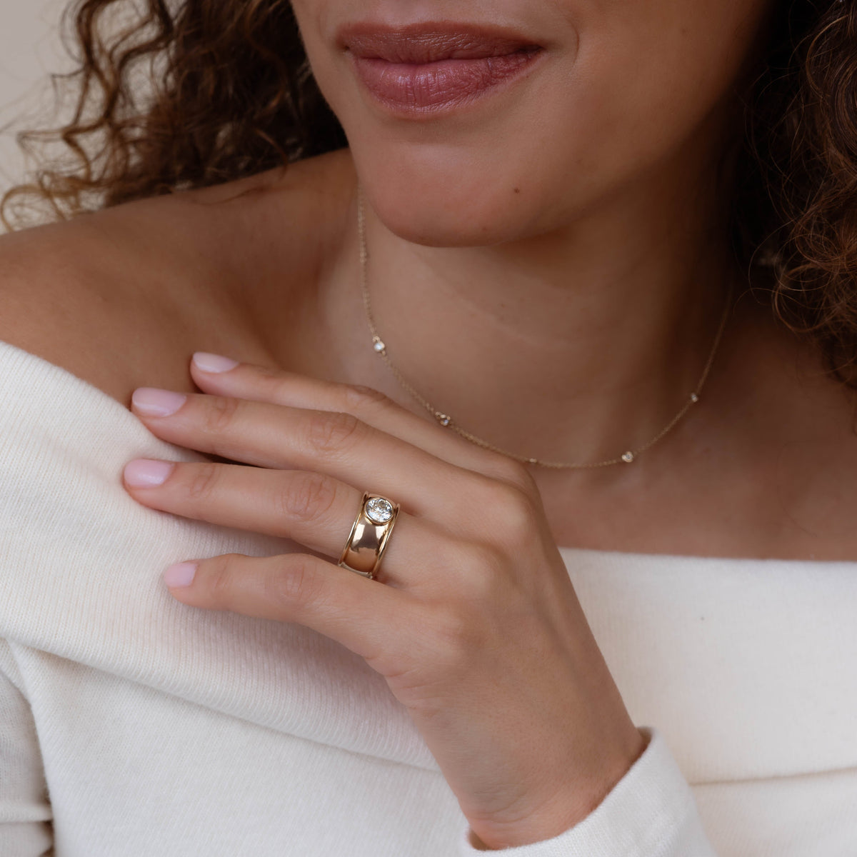 14k solid gold Commons engagement ring with a bezel-set diamond