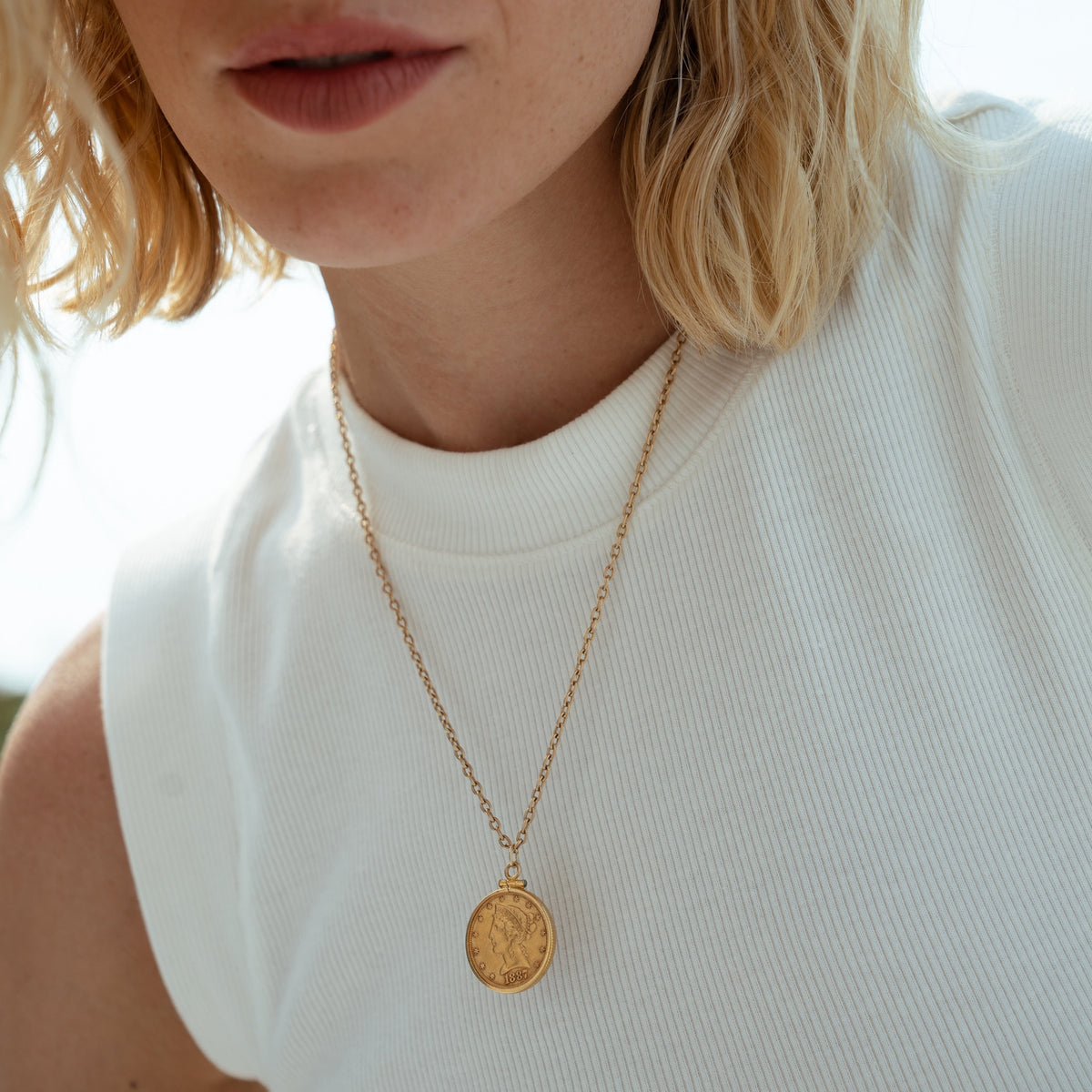 A Vintage 1887 USA Coin Charm solid gold on a solid gold Napa chain