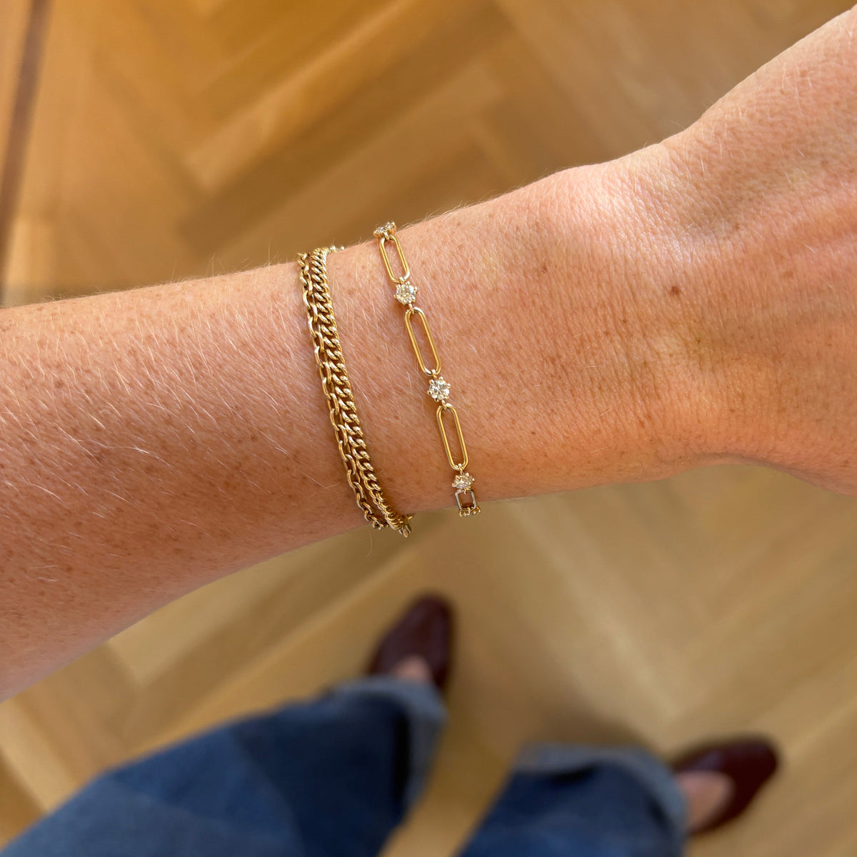 A solid gold link bracelet design with 3mm natural diamonds spaces throughout set in a 6-prong setting that is a nod to vintage style and resembles flowers