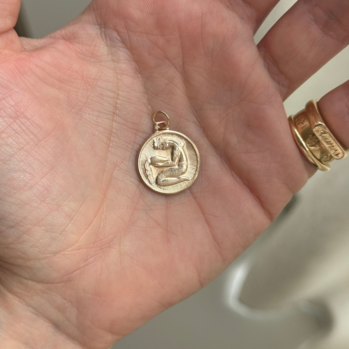 Vintage Aquarius Charm with Spiral Design on Back