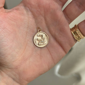 Vintage Aquarius Charm with Spiral Design on Back