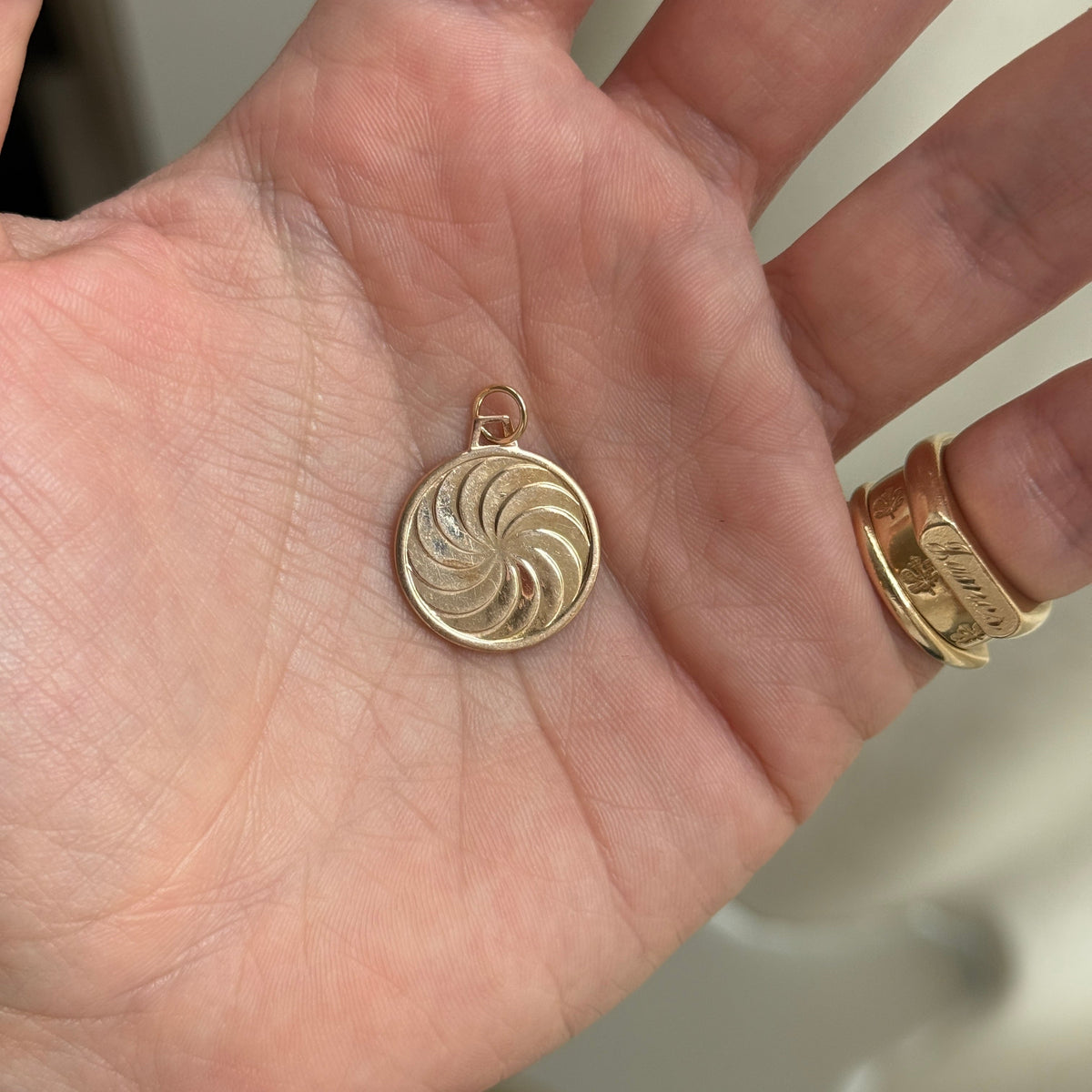 Vintage Aquarius Charm with Spiral Design on Back