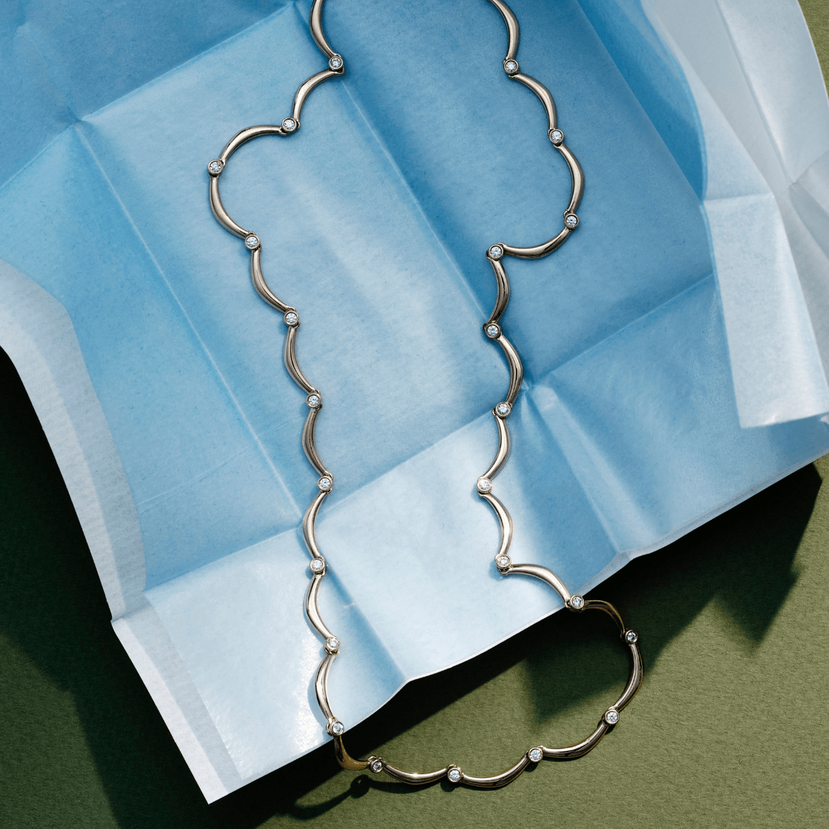 14k solid gold Diamond Coupe Necklace with bezel-set diamonds along the chain