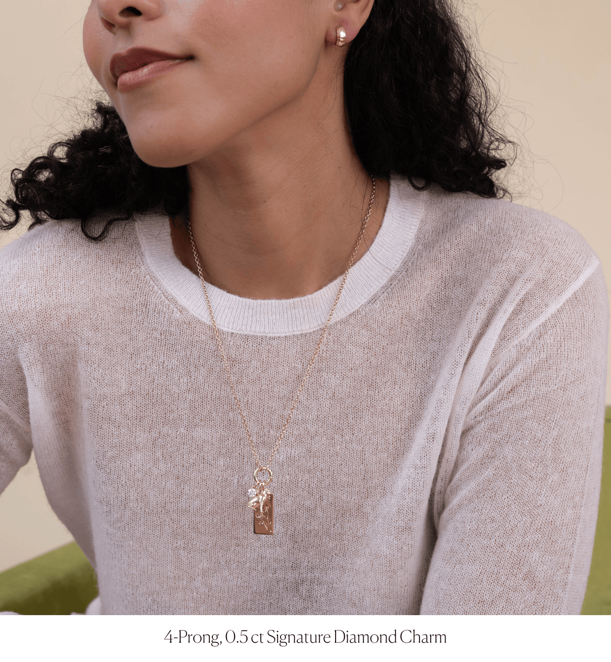 14k solid gold Signature Diamond Charm with a signature-cut diamond