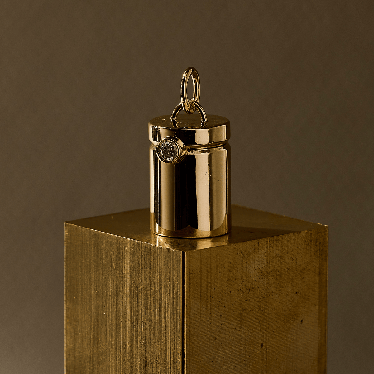 14k solid gold engravable Capsule Charm as an openable capsule locket