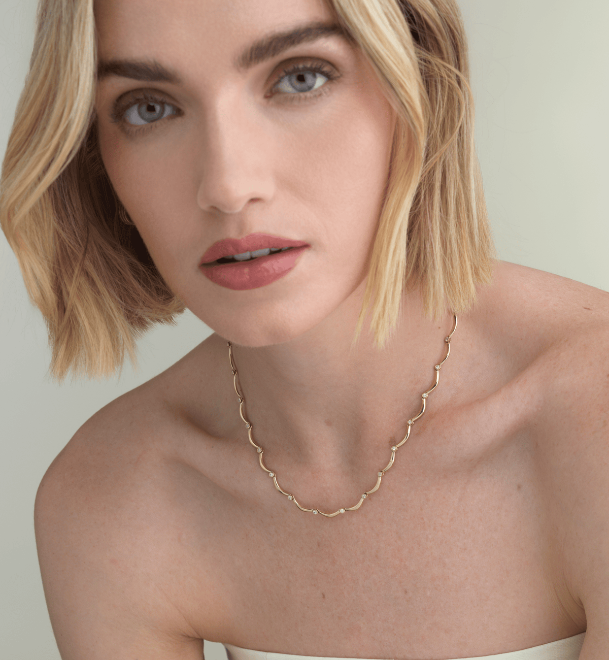 14k solid gold Diamond Coupe Necklace with bezel-set diamonds along the chain