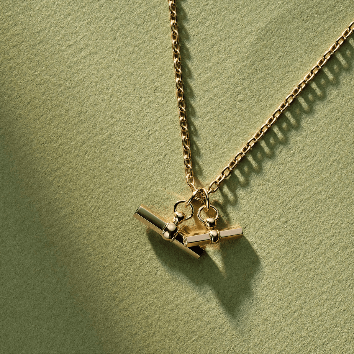 14k solid gold Toggle Charm with a toggle clasp design