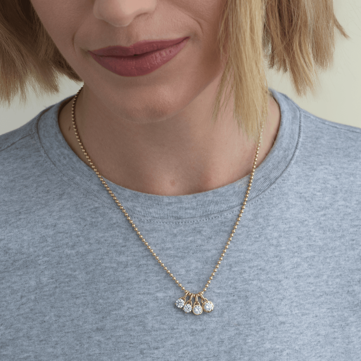 14k solid gold Signature Diamond Charm with a signature-cut diamond