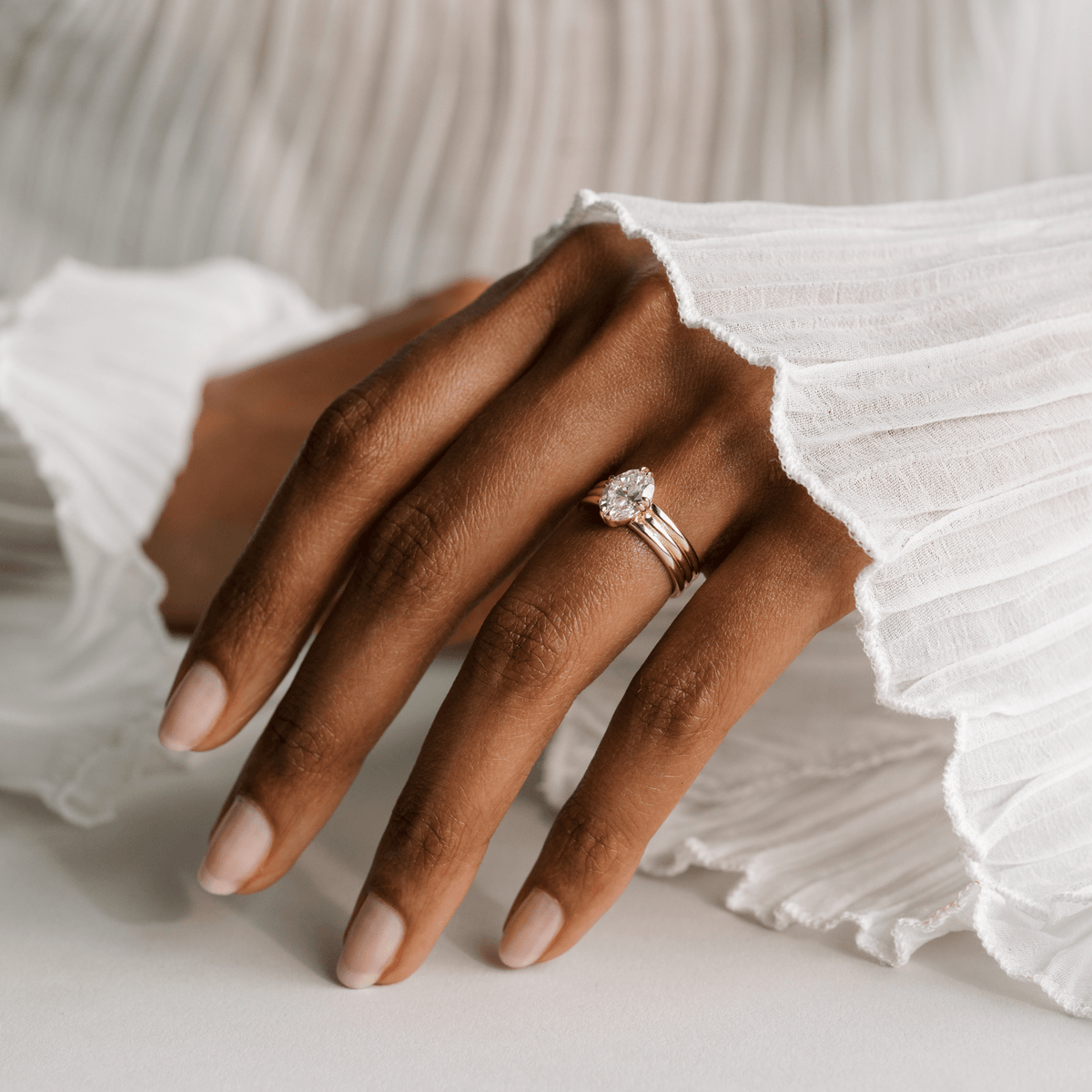 14k solid gold Cardinal engagement ring with a triple-band design