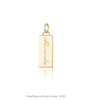 Hand engraved script name on the 14k solid gold rectangle charm