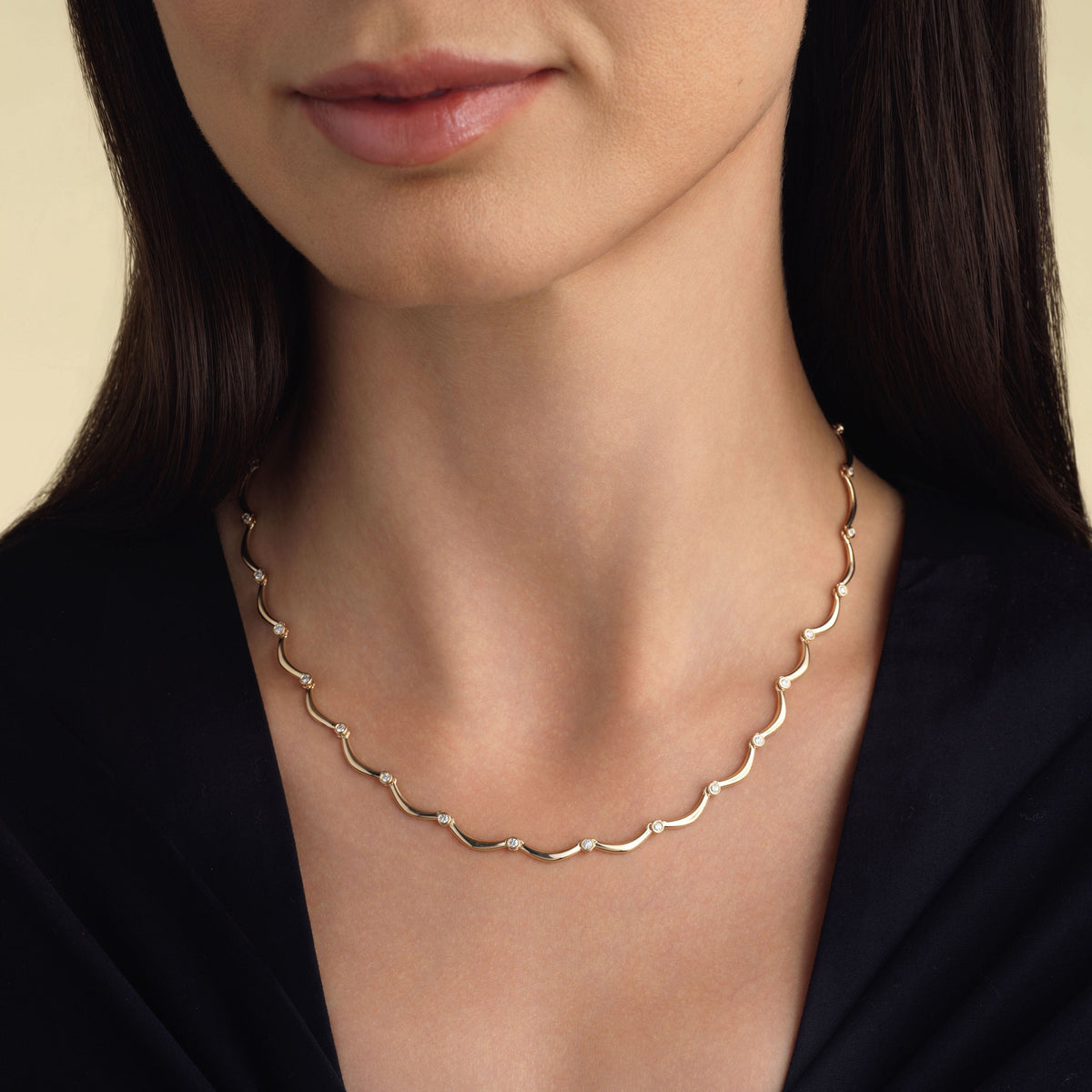 14k solid gold Diamond Coupe Necklace with bezel-set diamonds along the chain