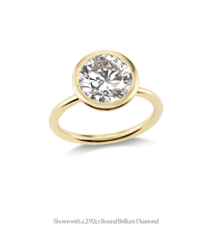 14k gold open bezel solitaire engagement ring with a round brilliant diamond