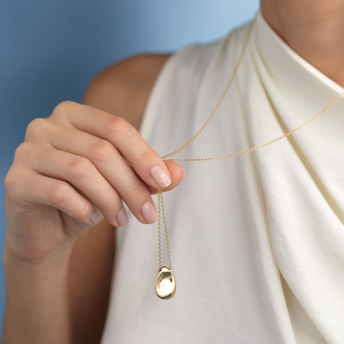 14k solid gold Worry Stone Necklace with a textured worry-stone pendant