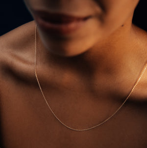 Model wearing the 14k gold cable chain necklace