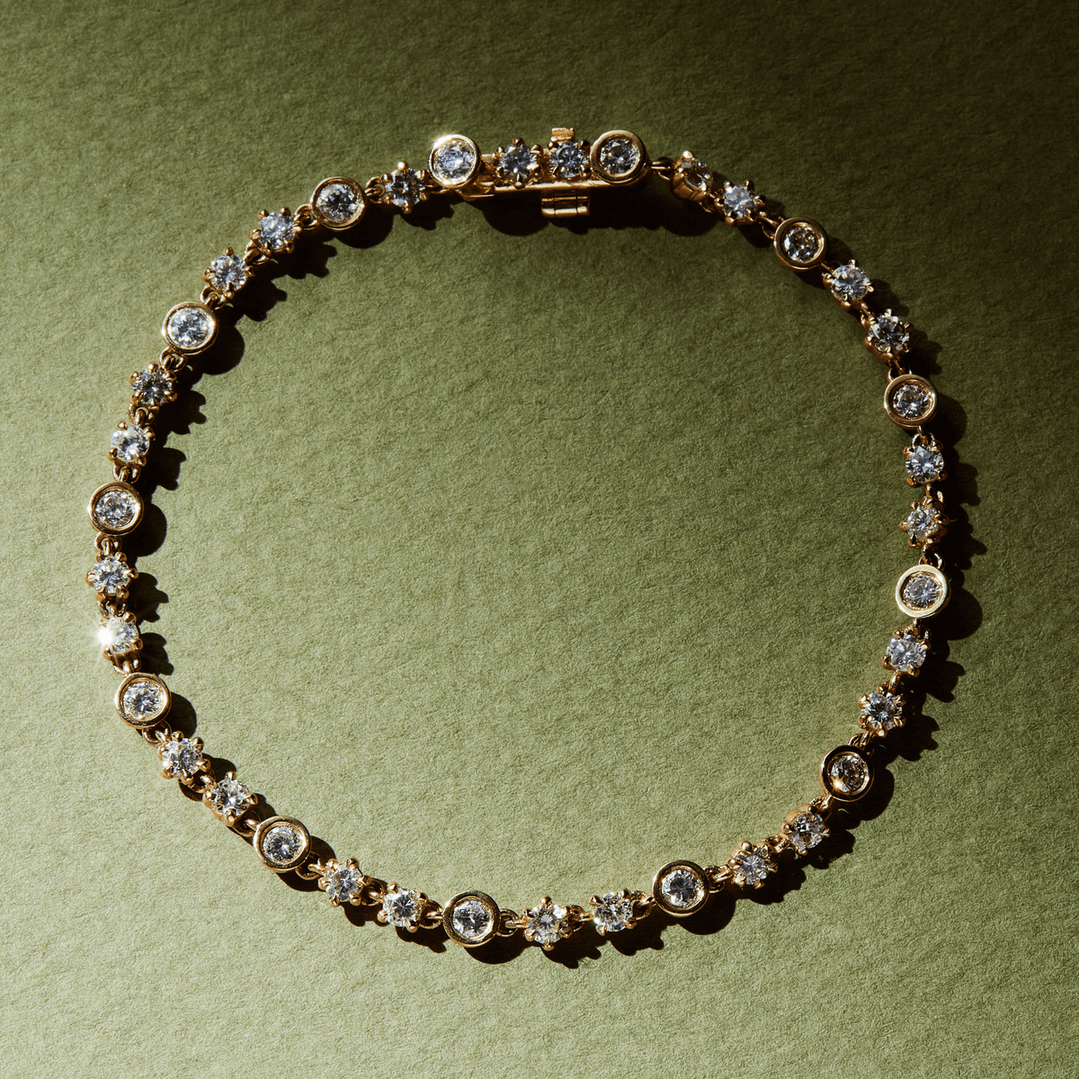 14k solid gold Tennis Bracelet with alternating diamond settings