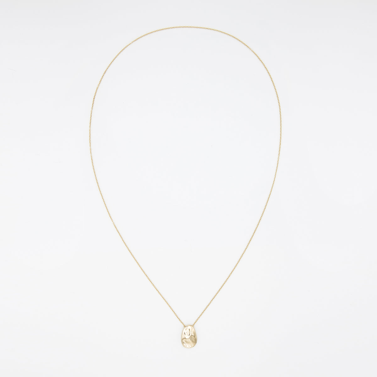 14k solid gold Worry Stone Necklace with a textured worry-stone pendant