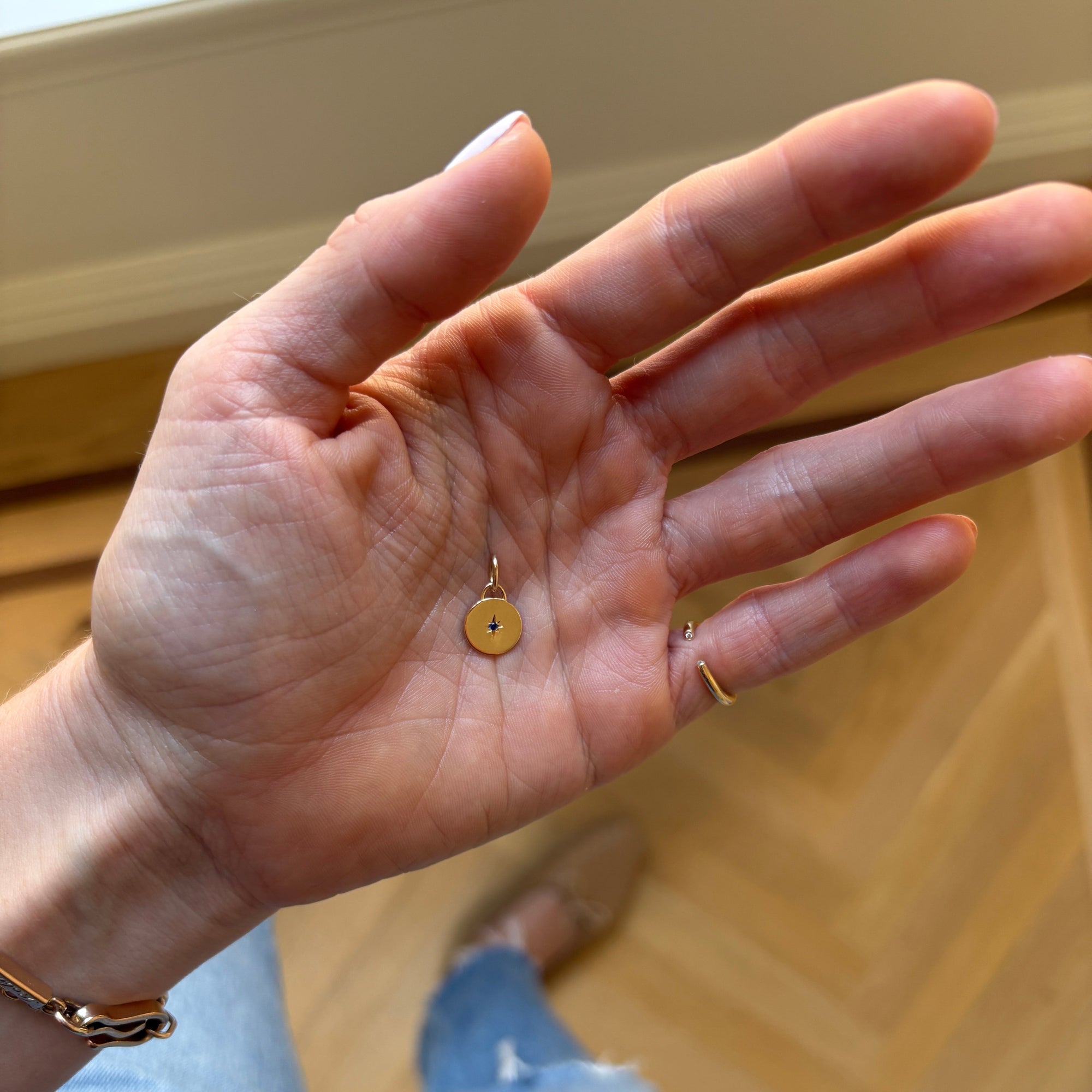 SOLD XS Circle Charm with Star Set Sapphire — Archive Sale