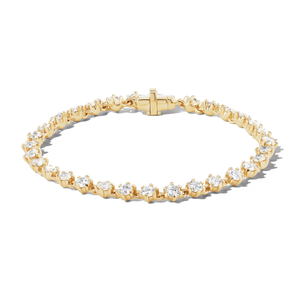 14k gold tennis bracelet with birdie-shaped links with diamonds