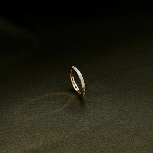 14k gold band with baguette diamonds across the entire band