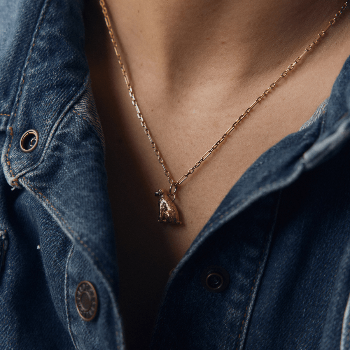 Model wearing 14k gold alternating link style chain necklace with Golden Doodle Dog Charm