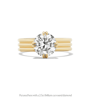 14k gold triple band design engagement ring with a round brilliant diamond