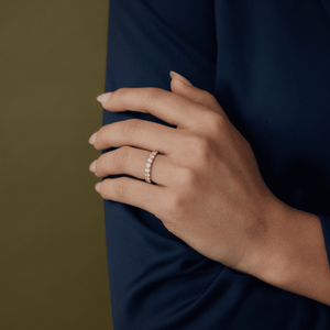 Model wearing 14k gold half eternity diamond ring