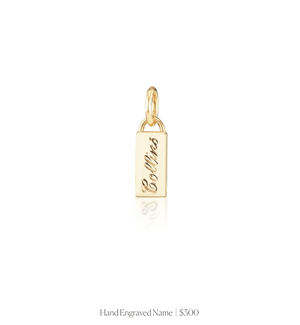 Hand engraved script name on the 14k solid gold rectangle charm 