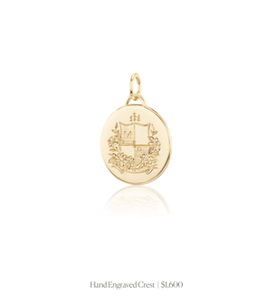 Hand engraved crest on the 14k solid gold circle charm