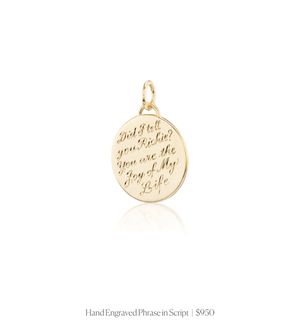 Hand engraved phrase in script on the 14k solid gold circle charm