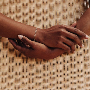 Model wearing a 14k gold link chain diamond bracelet