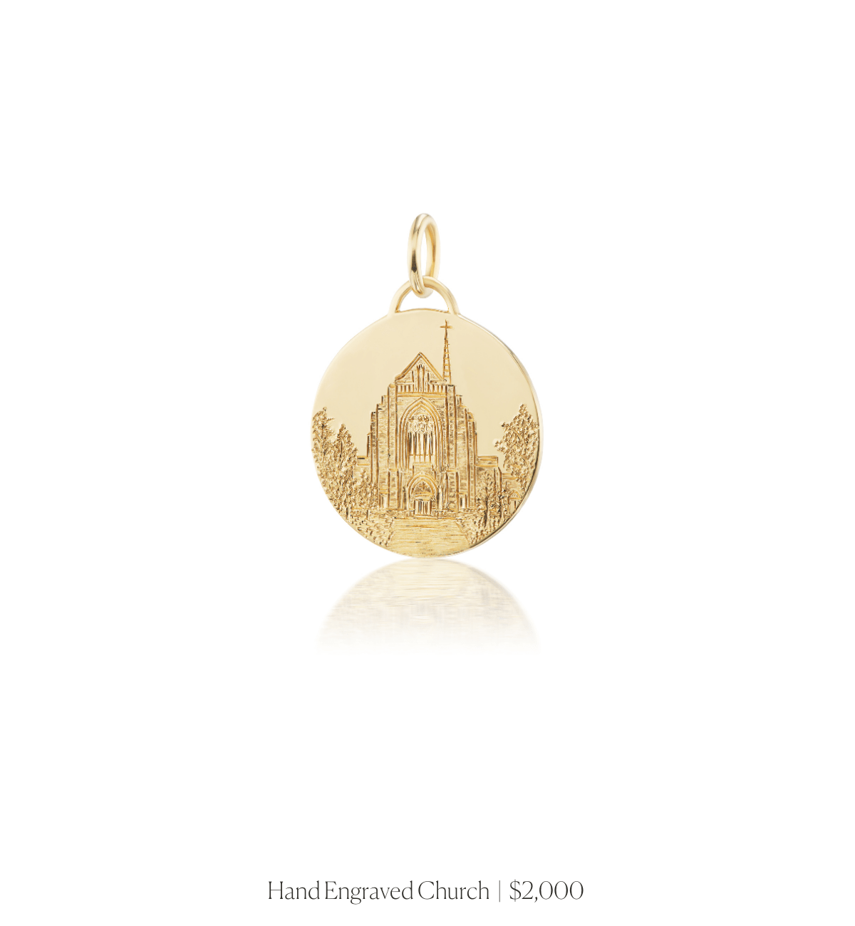 Hand engraved image of a church on the 14k solid gold circle charm