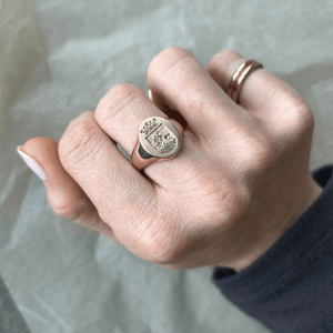 Model wearing 14k solid gold engraved signet ring