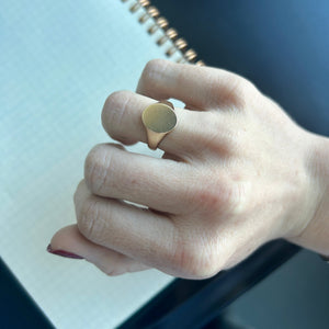 Model wearing 14k solid gold engravable signet ring