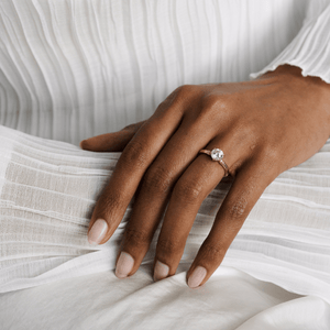 Model wearing the 14k gold double band knot design engagement ring