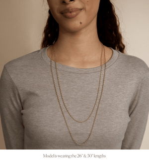 Model wearing all sizes in the 14k gold link chain necklace 