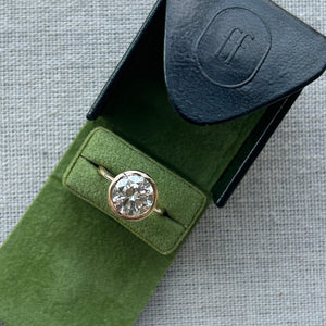 14k gold open bezel solitaire engagement ring in our green Fewer Finer Engagement Ring Box