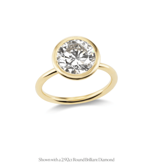 14k gold open bezel solitaire engagement ring with a round brilliant diamond