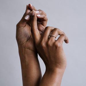 Model wearing 14k gold bezel set diamond ring