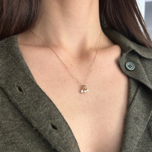 Model wearing 14k gold diamond charms