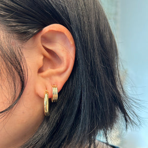 Model wearing 14k gold column-style hoops