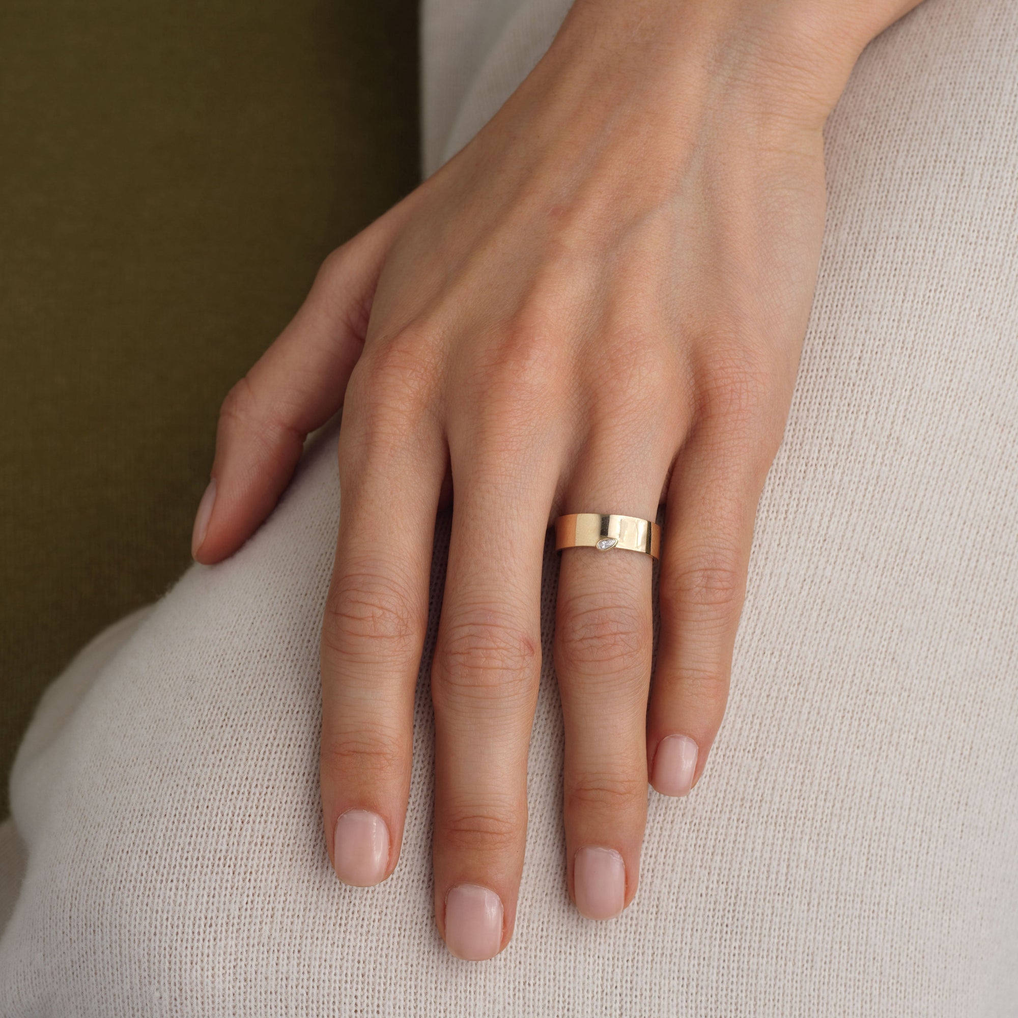 14k solid gold thick band ring with a bezel marquise diamond