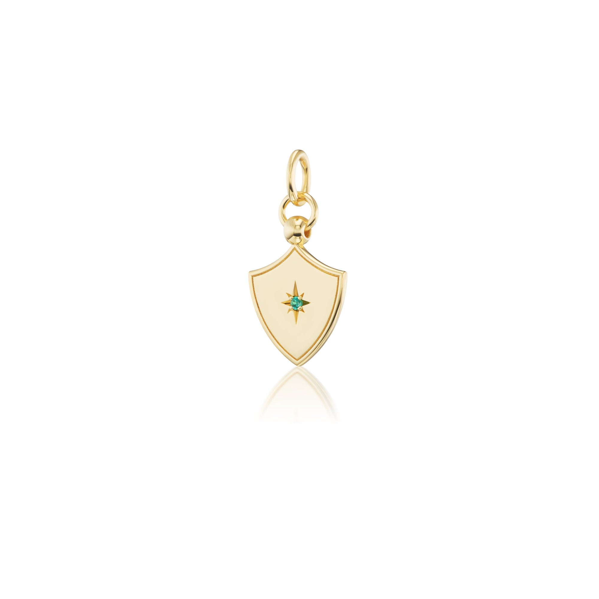 14k gold shield shaped charm with a star set gemstone in the middle