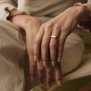 Model wearing 14k solid gold engravable straight signet ring