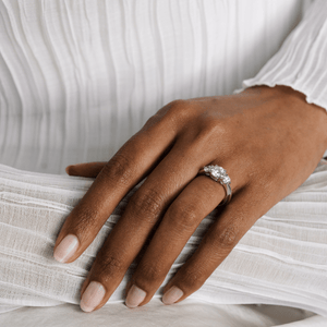 Model wearing the 14k white gold three stone diamond engagement ring