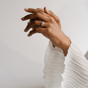 Model wearing the 14k white gold three stone diamond engagement ring