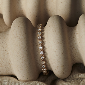 14k gold tennis bracelet with birdie-shaped links with diamonds